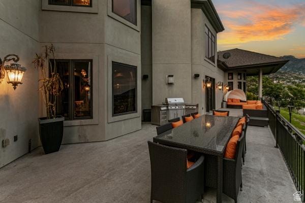 patio terrace at dusk with area for grilling