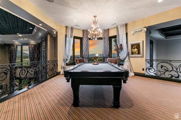 playroom with billiards, a raised ceiling, and carpet flooring