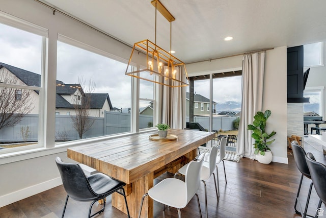 668 W Leroy Cir, Saratoga Springs, UT 84045 - dining room with a residential view, a notable chandelier, baseboards, and dark wood finished floors
