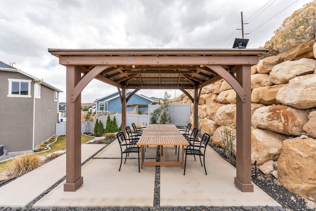 668 W Leroy Cir, Saratoga Springs, UT 84045 - view of patio with outdoor dining area, a gazebo, and fence
