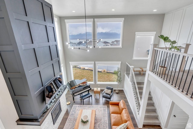 668 W Leroy Cir, Saratoga Springs, UT 84045 - living area featuring stairs, a notable chandelier, wood finished floors, and recessed lighting