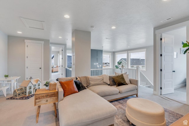 668 W Leroy Cir, Saratoga Springs, UT 84045 - living room featuring carpet, attic access, a textured ceiling, visible vents, and recessed lighting