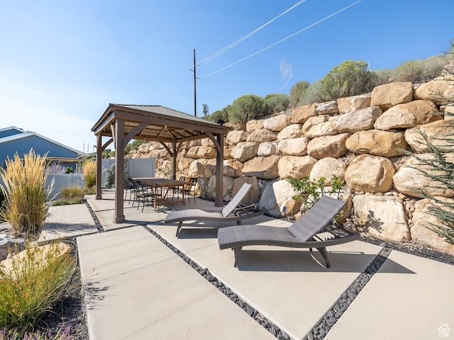 668 W Leroy Cir, Saratoga Springs, UT 84045 - view of patio / terrace with outdoor dining area, a gazebo, and fence
