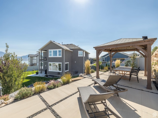 668 W Leroy Cir, Saratoga Springs, UT 84045 - view of patio / terrace with a residential view, outdoor dining area, a gazebo, and fence