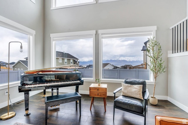 668 W Leroy Cir, Saratoga Springs, UT 84045 - sitting room featuring baseboards, a mountain view, and wood finished floors