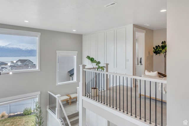 668 W Leroy Cir, Saratoga Springs, UT 84045 - hall featuring an upstairs landing, visible vents, recessed lighting, and a mountain view