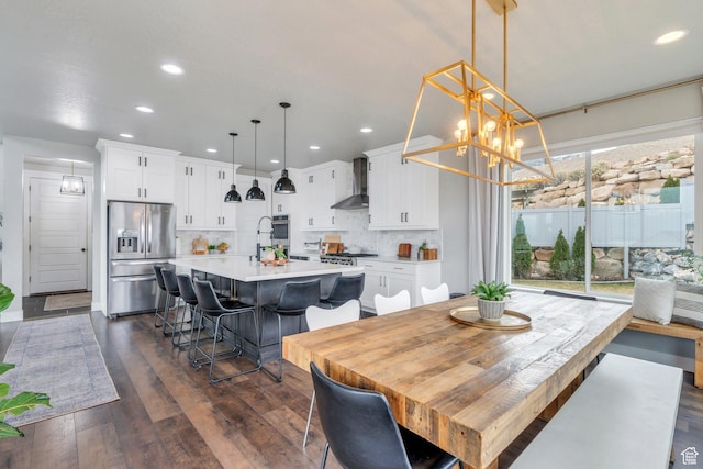 668 W Leroy Cir, Saratoga Springs, UT 84045 - dining area with dark wood-style flooring, a notable chandelier, and recessed lighting