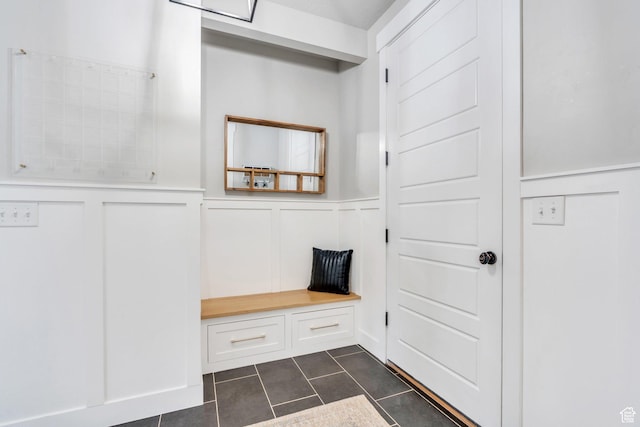 668 W Leroy Cir, Saratoga Springs, UT 84045 - mudroom with a wainscoted wall, a decorative wall, and dark tile patterned floors
