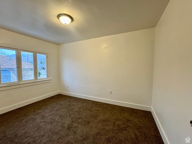 2721 Gramercy Ave, Ogden, UT 84403 - empty room featuring baseboards and dark colored carpet