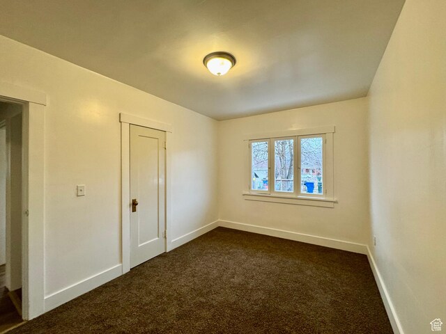 2721 Gramercy Ave, Ogden, UT 84403 - unfurnished room with baseboards and dark colored carpet