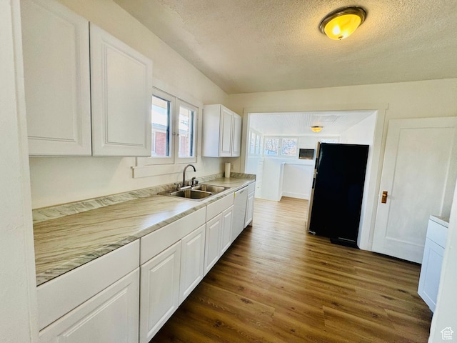 2721 Gramercy Ave, Ogden, UT 84403 - kitchen featuring a sink, dark wood finished floors, freestanding refrigerator, white cabinets, and light countertops