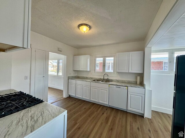 2721 Gramercy Ave, Ogden, UT 84403 - kitchen with a sink, freestanding refrigerator, light wood-style floors, and white dishwasher