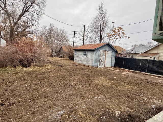 2721 Gramercy Ave, Ogden, UT 84403 - view of yard with a storage shed, an outdoor structure, and fence