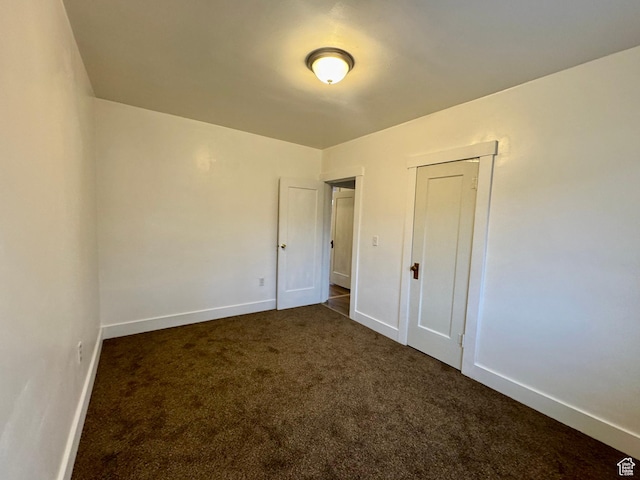 2721 Gramercy Ave, Ogden, UT 84403 - unfurnished bedroom featuring baseboards and dark colored carpet