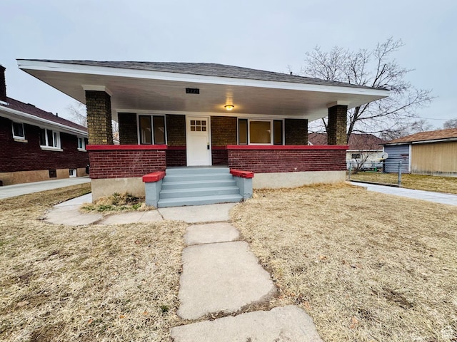 2721 Gramercy Ave, Ogden, UT 84403 - bungalow with brick siding and covered porch