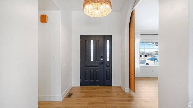 foyer entrance with light hardwood / wood-style flooring