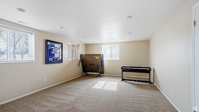 unfurnished room with light carpet
