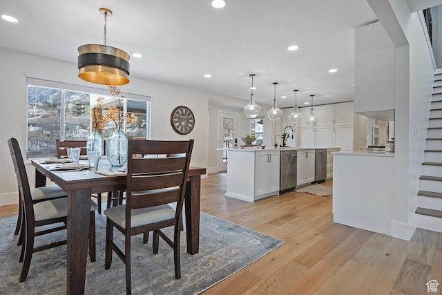 dining room featuring plenty of natural light, recessed lighting, and light wood-style flooring