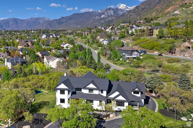 bird's eye view with a residential view and a mountain view