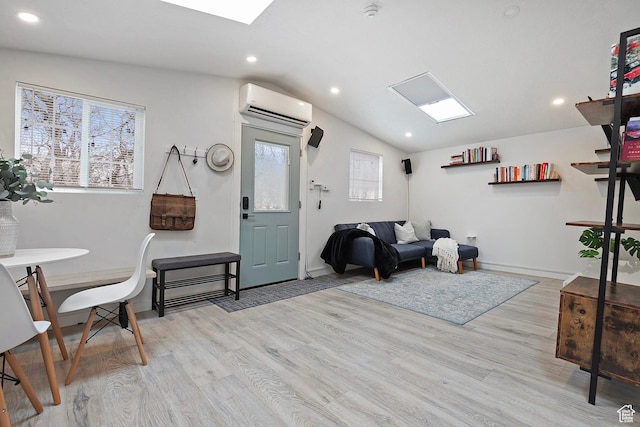 sitting room featuring wood finished floors, lofted ceiling, baseboards, recessed lighting, and a wall unit AC