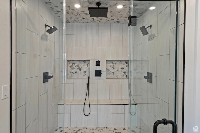 bathroom with a shower stall