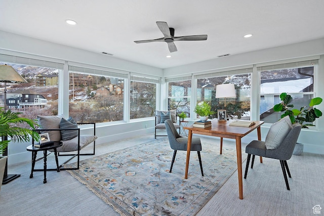carpeted office space featuring a ceiling fan, baseboards, visible vents, and recessed lighting