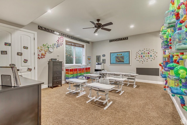 rec room with ceiling fan and carpet floors