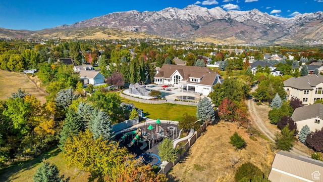 birds eye view of property with a mountain view