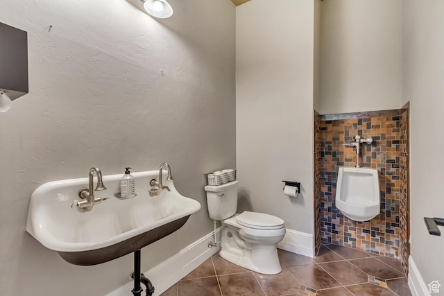bathroom with sink, tile patterned floors, and toilet