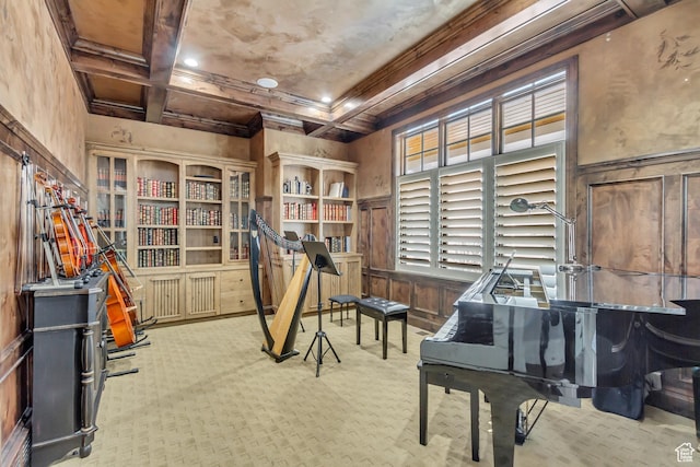 misc room with coffered ceiling, beam ceiling, light carpet, and ornamental molding