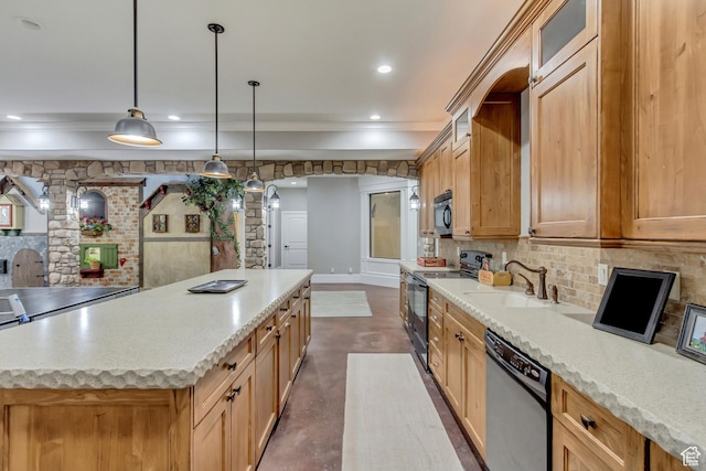 kitchen with sink, hanging light fixtures, backsplash, a center island, and black appliances