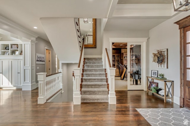 foyer entrance featuring dark hardwood / wood-style floors