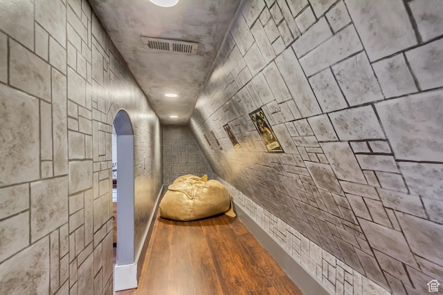 hallway with hardwood / wood-style floors