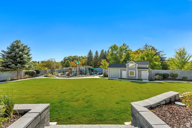 view of yard featuring an outdoor structure and a playground