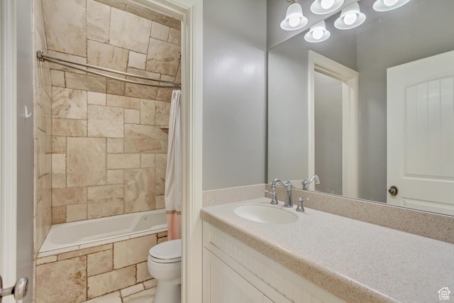 full bathroom featuring toilet, vanity, and shower / bathtub combination with curtain