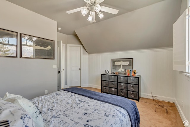 bedroom with lofted ceiling, light colored carpet, and ceiling fan