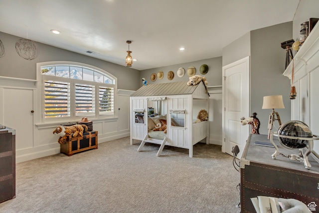 bedroom with light colored carpet