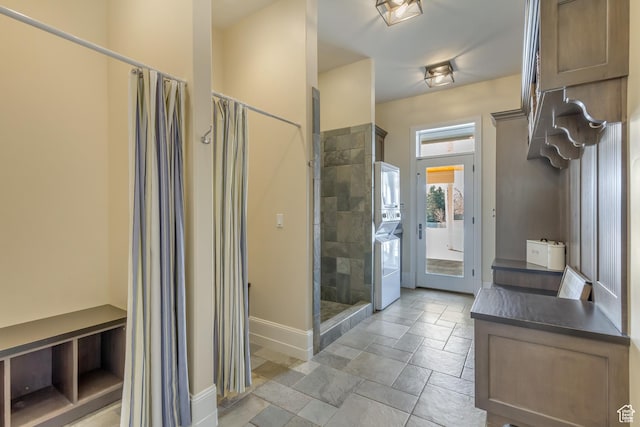 bathroom with vanity and tiled shower