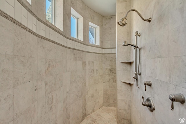 bathroom with a tile shower