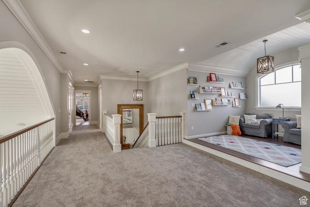interior space featuring crown molding, light colored carpet, and a chandelier
