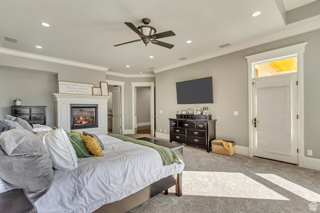 carpeted bedroom with crown molding and ceiling fan