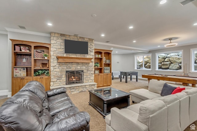 carpeted living room featuring pool table, a stone fireplace, and ornamental molding