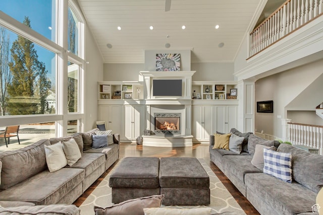 living room featuring wood ceiling, wood-type flooring, and high vaulted ceiling