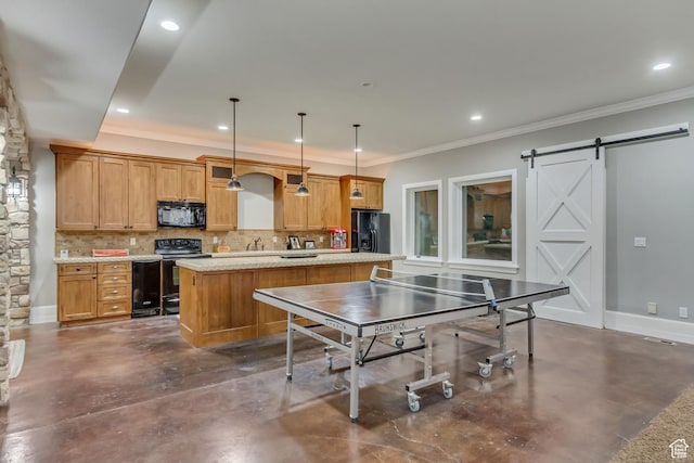 rec room featuring crown molding and a barn door
