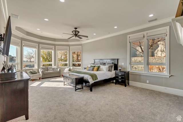 carpeted bedroom featuring ornamental molding and ceiling fan