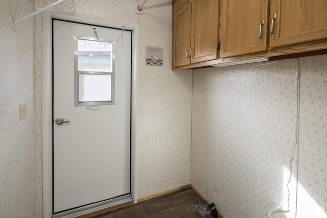 laundry room featuring dark wood-type flooring