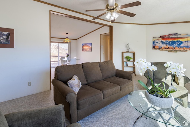carpeted living room with crown molding, ceiling fan, and vaulted ceiling