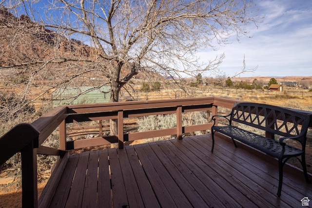 wooden deck featuring a rural view