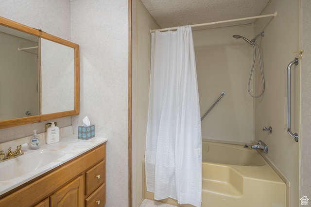bathroom with vanity, a textured ceiling, and shower / tub combo with curtain