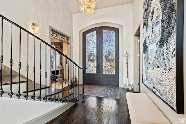 9632 N 5650 W, Highland, UT 84003 - foyer entrance featuring french doors, dark hardwood / wood-style flooring, and a chandelier
